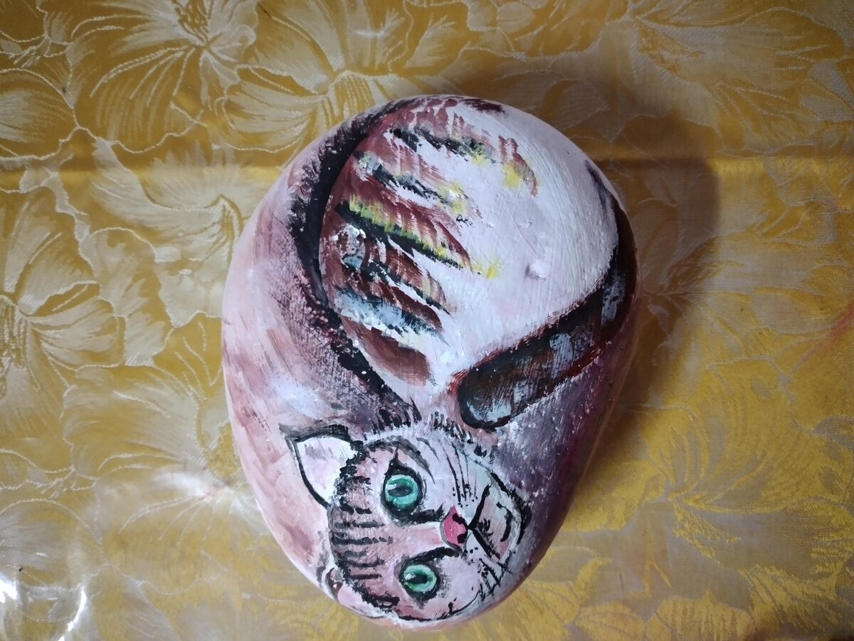Cat painted on rock